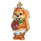 Mellow Monkey Silly Christmas Squirrel ornament, blown glass, wearing a green scarf and diaper, holding a gift.