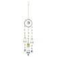 Mellow Monkey Circle of Life suncatcher with crystals, healing stones, and gold celestial charms on hanging chains.