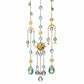 Mellow Monkey Circle of Life suncatcher with gold sun, moon, and star charms, crystals, and iridescent beads.