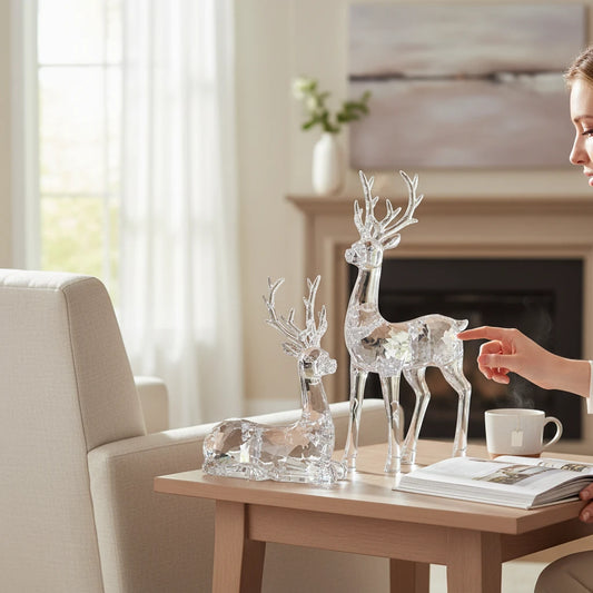 Mellow Monkey clear sculpted acrylic deer figurines in sitting and standing poses on a wooden table in a living room