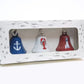Mellow Monkey 3-pack of steel coastal holiday bells featuring anchor, lobster, and lighthouse designs in a gift box.