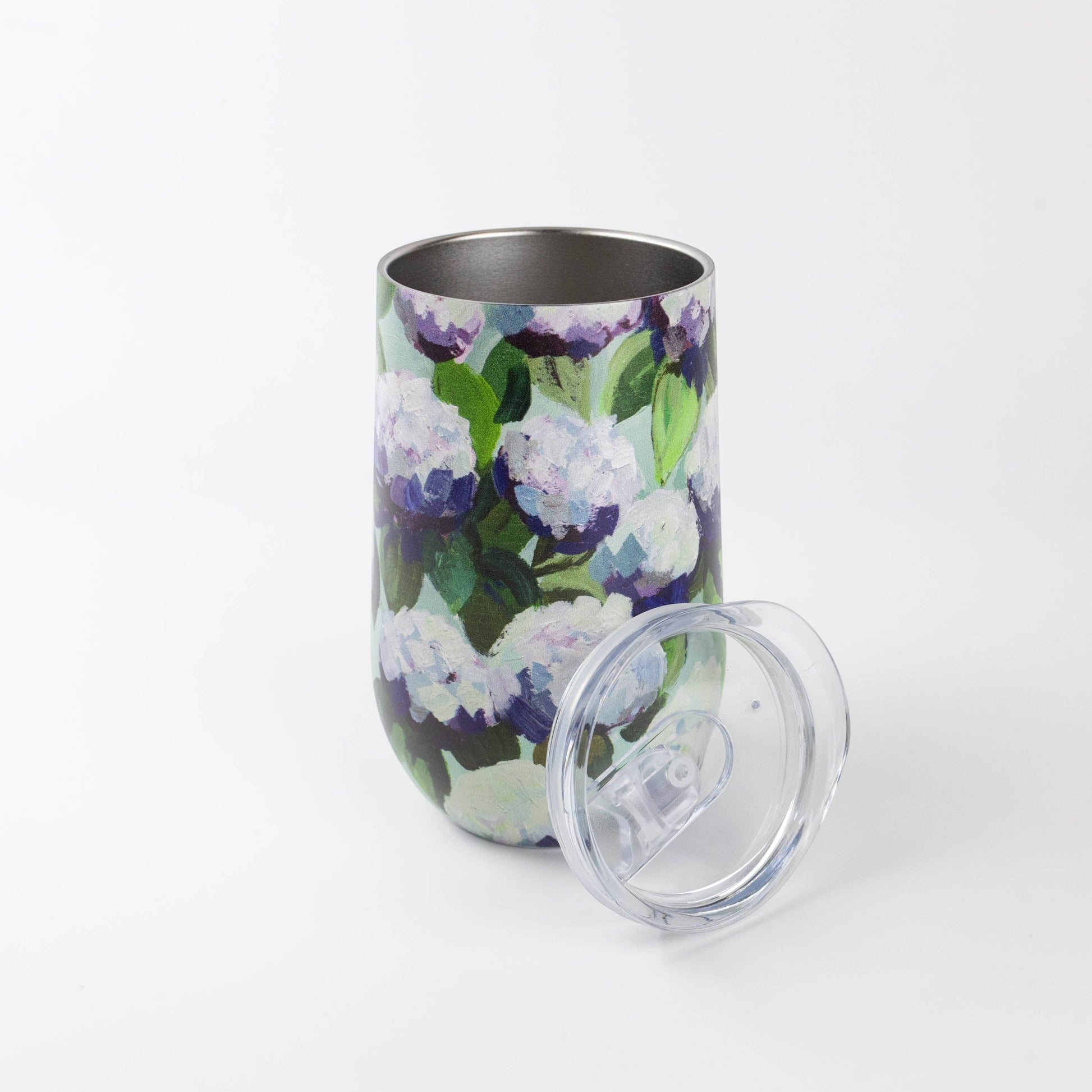 Mellow Monkey 16oz stainless steel wine tumbler featuring a blue and purple coastal hydrangea floral pattern with lid.