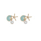 Mellow Monkey coastal earring trio featuring gold starfish, blue enamel shells, and white pearl studs.
