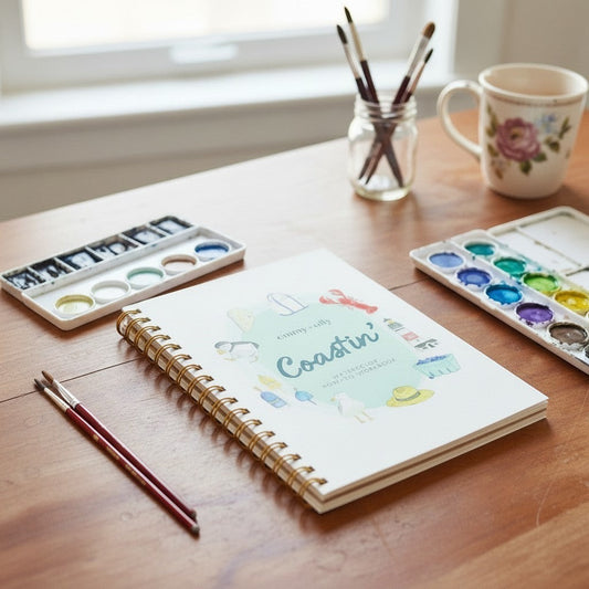 Mellow Monkey Coastin’ watercolor workbook with step-by-step instructions and perforated pages for a relaxing painting experience.
