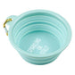 Mellow Monkey light blue collapsible silicone pet bowl with carabiner and "Sparkling or Still?" text.