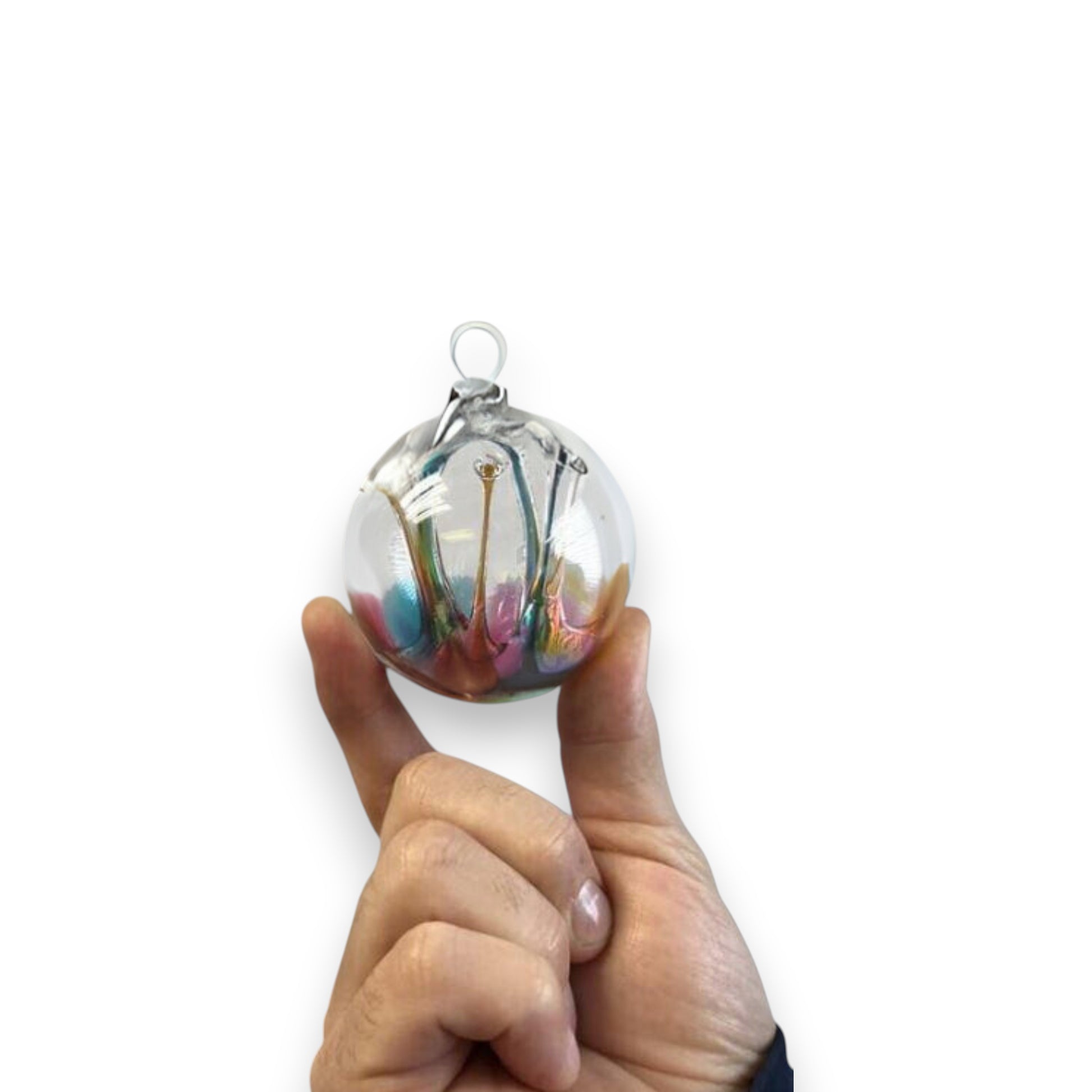 Mellow Monkey 4-inch colorful glass wish ball ornament held in hand, featuring swirling vibrant interior colors.