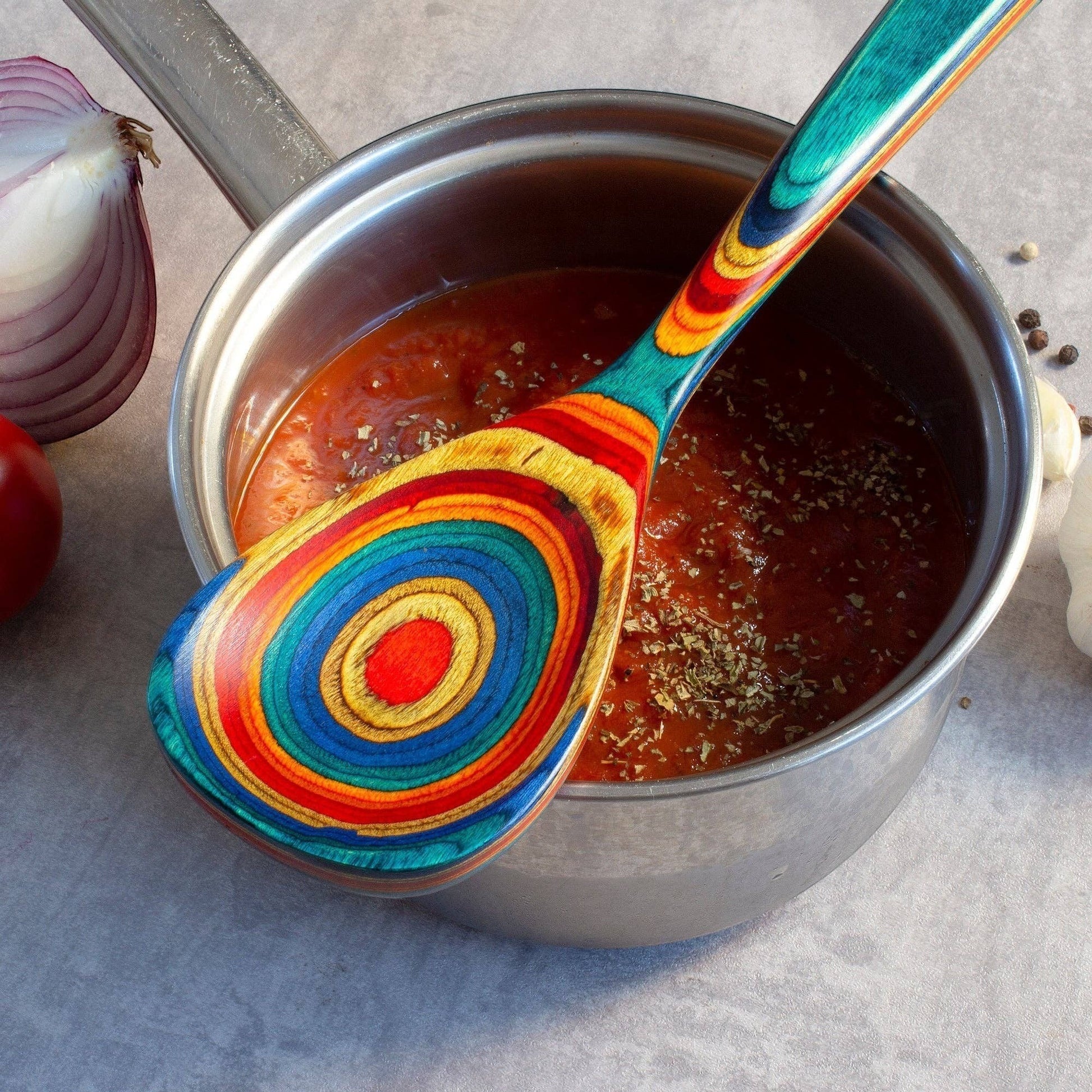 Mellow Monkey Montego Bay colorful wooden cooking spoon with teal, blue, red, orange, and yellow swirls. 12.5-in.