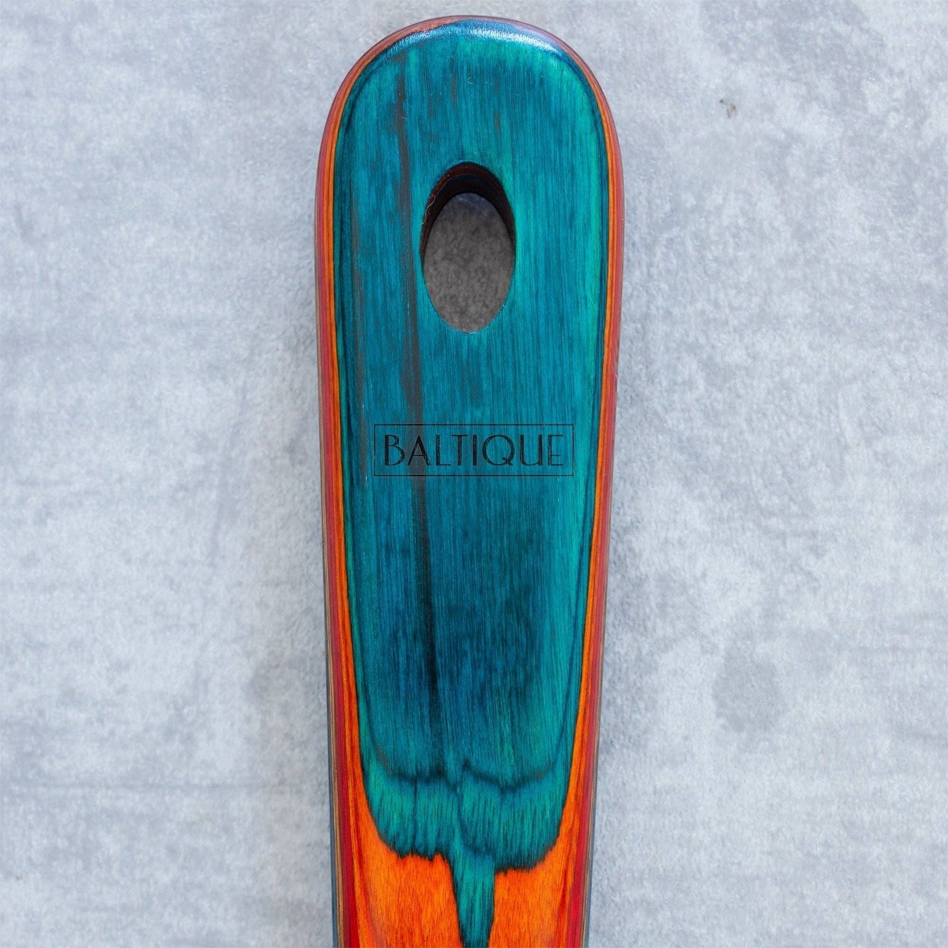 Mellow Monkey Baltique colorful wooden cooking spoon with teal, blue, and orange hues. 12.5-inch length.