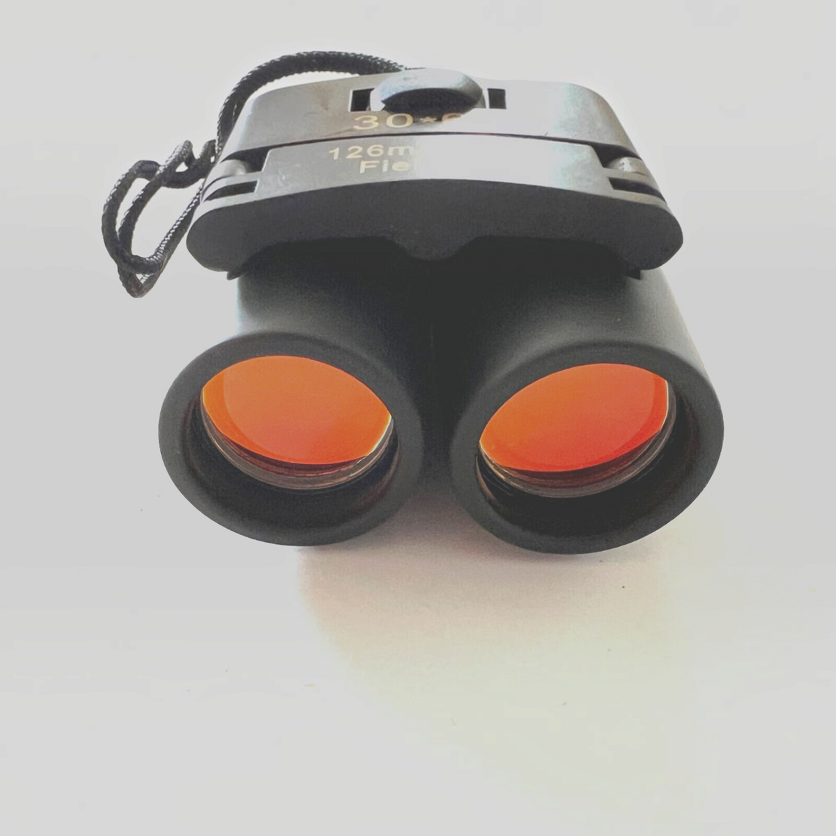 Mellow Monkey 30x60 compact roof prism binoculars with orange-tinted lenses for hunting and outdoor travel.