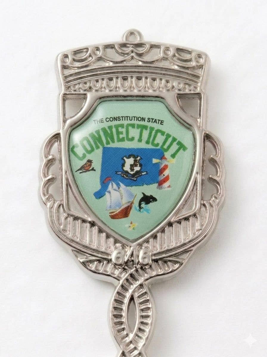 Mellow Monkey Connecticut jumbo souvenir spoon featuring a detailed state emblem with a shield, crown, and laurel.