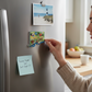 Mellow Monkey flexible Connecticut state-shaped souvenir magnet with colorful landmark illustrations on a refrigerator