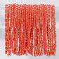 Mellow Monkey coral seed bead stretch bracelets with 18K gold plated brass accents for a vibrant layered look.