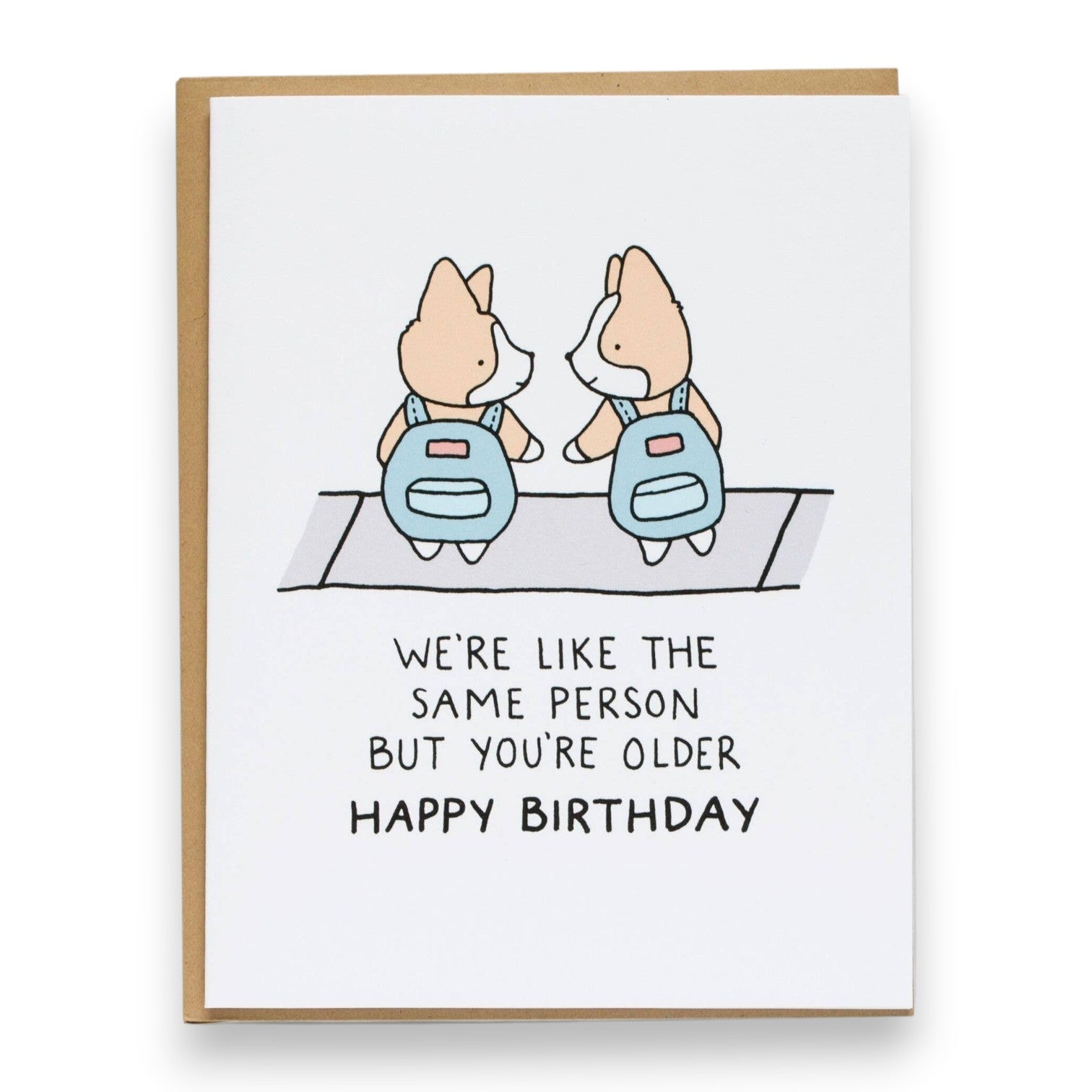 Mellow Monkey birthday card featuring two cute corgis in blue backpacks with the text We're like the same person but you're older happy birthday.