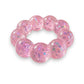Mellow Monkey Cotton Candy Sparkle Feelzies sensory bracelet with pink glittery bubbles on a marble surface.
