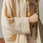 Mellow Monkey cream 4-layer muslin kimono robe with hand-painted evil eye detail on back. Organic cotton.