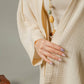 Mellow Monkey cream 4-layer muslin kimono robe with hand-painted evil eye detail on back. Organic cotton.