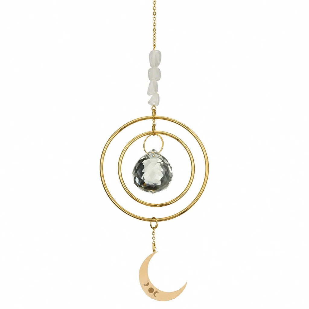 Mellow Monkey celestial crescent moon suncatcher with gold rings, metallic chains, and a clear crystal prism.