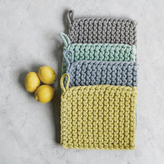 Mellow Monkey thick crocheted cotton pot holders in gray, mint green, blue, and yellow with hanging loops. 8-in square.