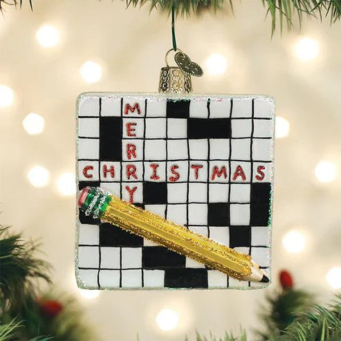 Mellow Monkey Crossword Puzzle blown glass holiday ornament with glitter pencil and "Merry Christmas" text.