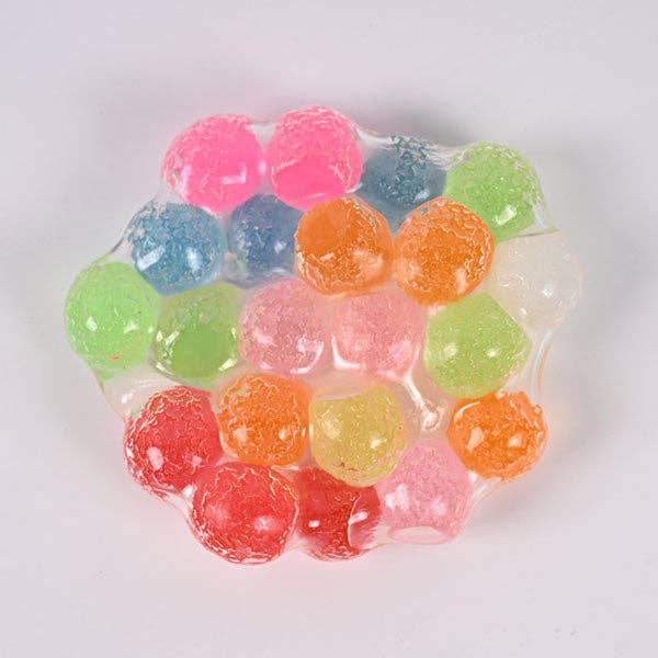 Mellow Monkey Crunch & Squish candy-themed stress ball with colorful crunchy sensory beads in clear gel