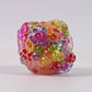 Mellow Monkey Crunch & Squish candy-themed stress ball with a vibrant, multi-colored translucent crunchy texture.