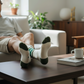 Mellow Monkey Daddy gym crew socks in white with green accents worn by a man relaxing on a sofa