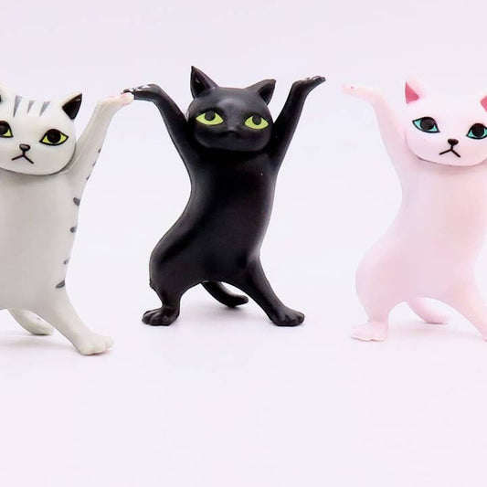 Mellow Monkey 2-inch dancing cat figurines in grey tabby, black, and pink standing in a row on a white background.