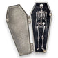 Mellow Monkey Dead Inside open coffin enamel pin with a hinged magnetic door revealing a detailed skeleton inside.