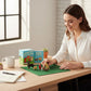 Mellow Monkey Desktop Dog Park kit with five resin dog figurines, a fire hydrant, and a felt lawn on a desk.