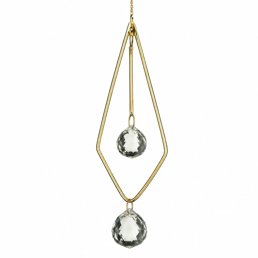 Mellow Monkey diamond-shaped celestial suncatcher with bronze wire frame and two shimmering faceted crystal pendants.