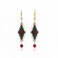 Mellow Monkey diamond-shaped earrings featuring white enamel, green leaves, red berries, and surgical steel wires.