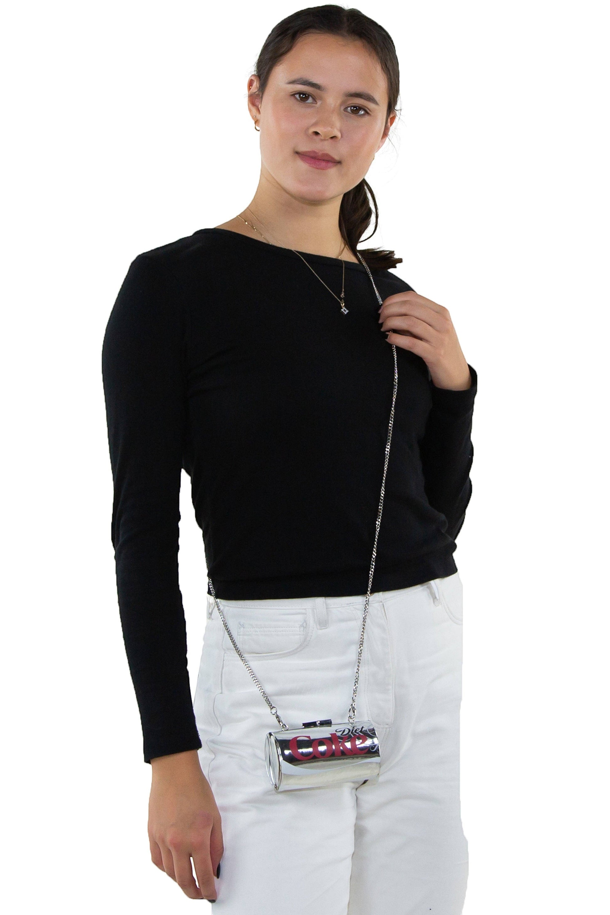 Model wearing a Mellow Monkey metallic silver Diet Coke can novelty crossbody bag with a detachable chain strap.