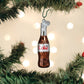 Mellow Monkey Mini Diet Coke bottle blown glass holiday ornament, 2.75 inches. Features a silver cap and a heart charm.