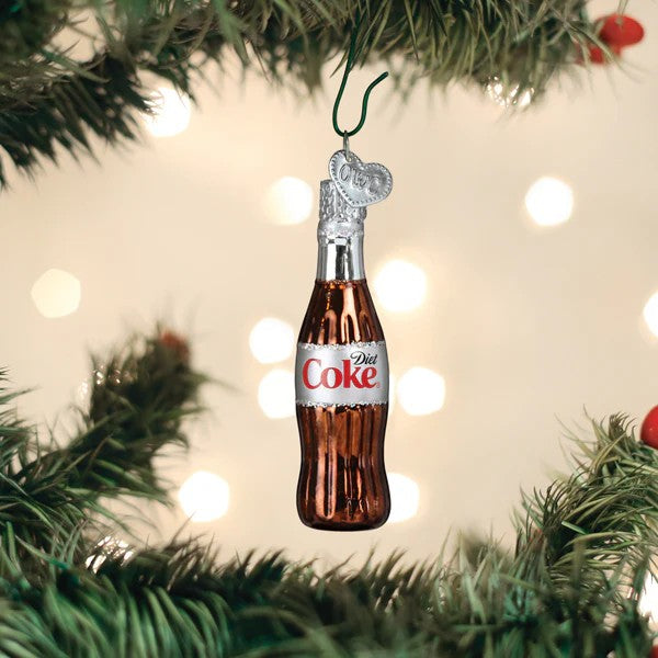 Mellow Monkey Mini Diet Coke bottle blown glass holiday ornament, 2.75 inches. Features a silver cap and a heart charm.