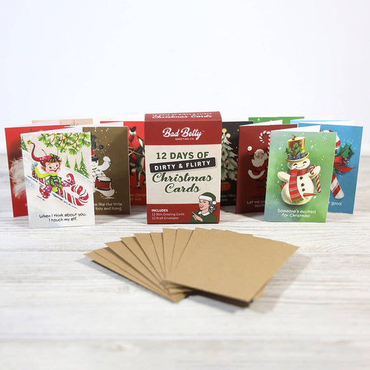 Mellow Monkey 12 Days of Dirty & Flirty Christmas card set with miniature cards, kraft envelopes, and gift box.