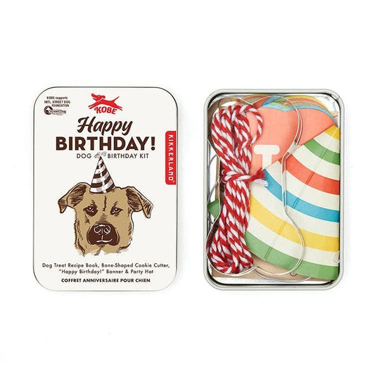 Mellow Monkey Dog Birthday Kit with hat, banner, cookie cutter, and recipe book. Features a dog wearing a party hat.