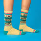 Mellow Monkey gym crew socks in yellow with teal and pink stripes and the text I Like Dogs More Than People