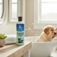 Mellow Monkey Really Good Doggie Shampoo bottle with 10% aloe vera on a bathroom counter near a bathing puppy