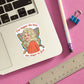 Mellow Monkey Dolly Parton die cut vinyl sticker with butterfly wings on a laptop surface