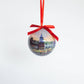 Mellow Monkey decoupage Christmas ornament featuring Kim Hovell Downtown artwork with a red ribbon hanging loop