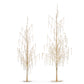 Mellow Monkey decorative holiday trees with gold branches and cascading pearl and crystal accents on round bases.