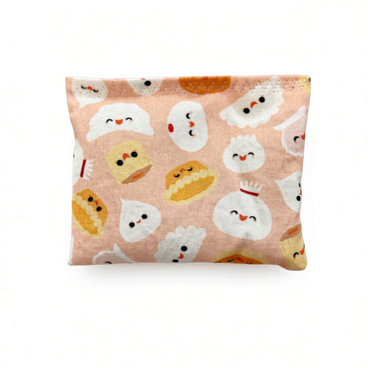 Mellow Monkey Mantra Beads sensory calm bag in a peach fabric featuring a cute dumpling pattern for quiet fidgeting.
