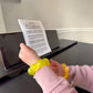 Mellow Monkey Electric Lemon Feelzies sensory bracelet on a child's wrist while playing piano.