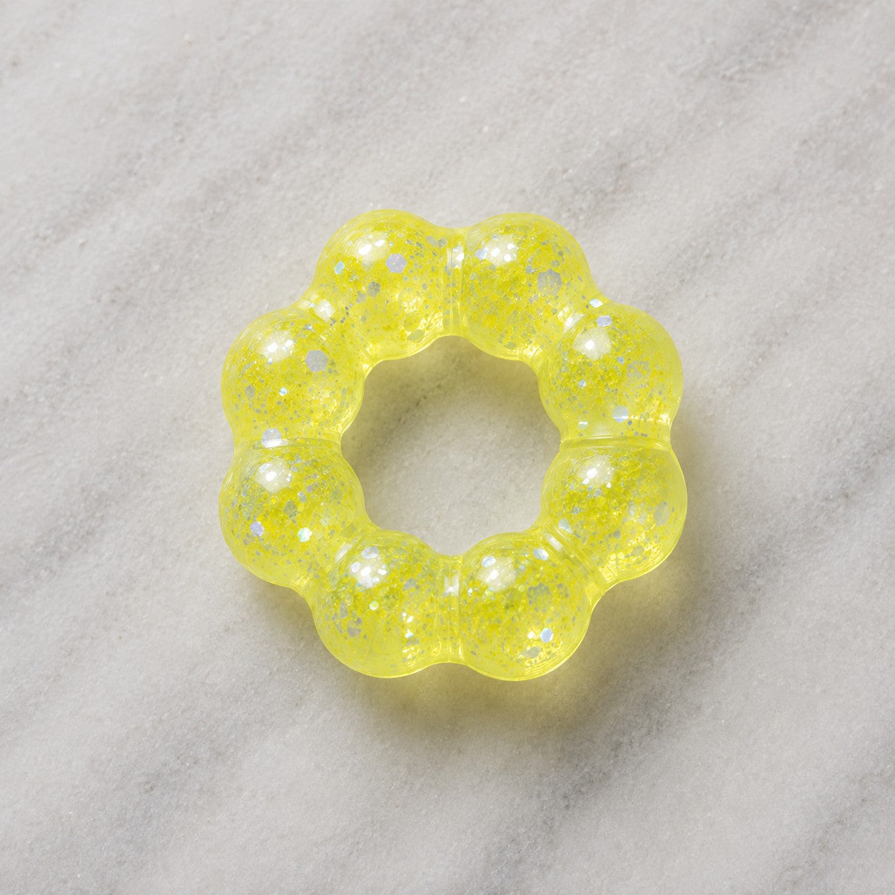 Mellow Monkey Electric Lemon Feelzies Original sensory bracelet in translucent yellow with silver glitter accents.