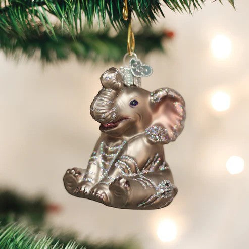 Mellow Monkey Little Elephant Old World Christmas blown glass ornament, grey with glitter accents, sitting pose.