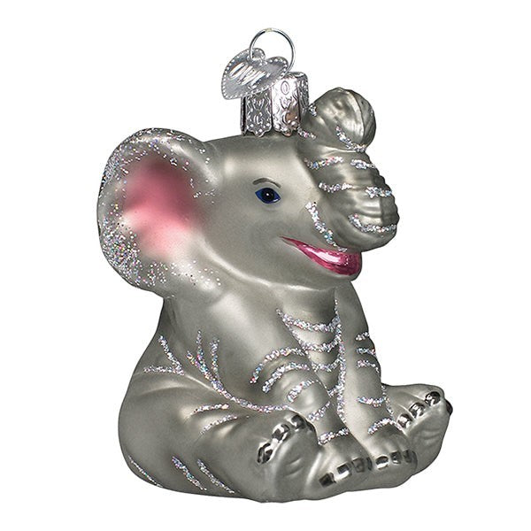 Mellow Monkey Little Elephant Old World Christmas blown glass ornament, silver with glitter accents and pink inner ears.