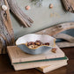 Mellow Monkey ENCANTO Carola small round bowl in turquoise and white with gold rim, filled with nuts.