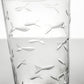 Mellow Monkey 15-oz highball glass featuring diamond-wheel engraved school of fish design on clear domestic glass