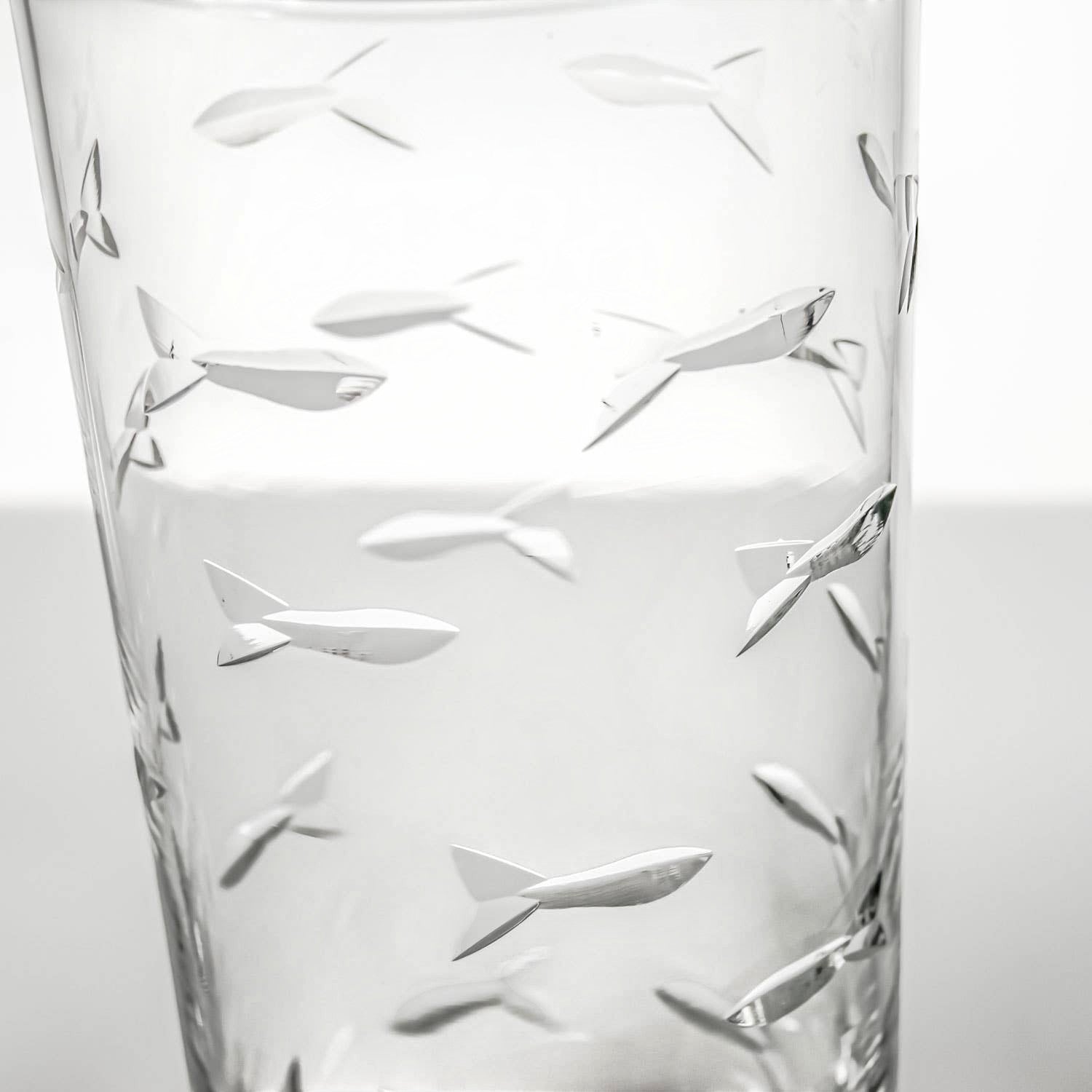 Mellow Monkey 15-oz highball glass featuring diamond-wheel engraved school of fish design on clear domestic glass