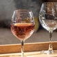Mellow Monkey 18-oz balloon red wine glass featuring an etched school of fish design on clear domestic glass